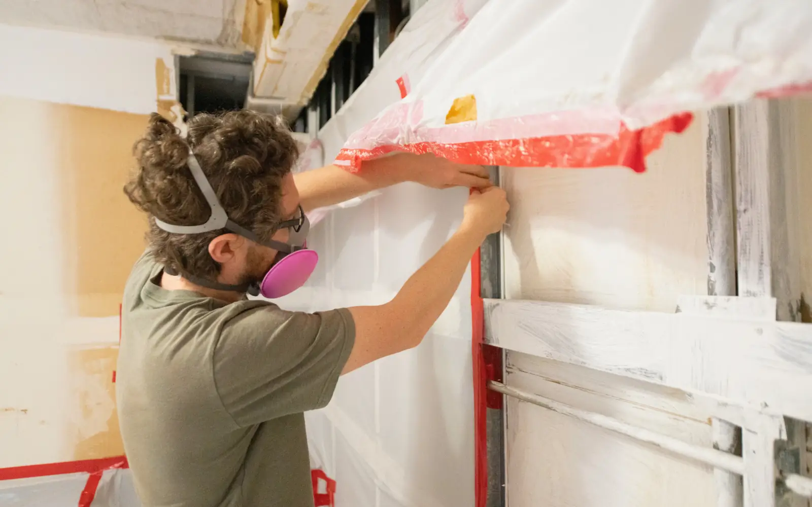 A mold remediation contractor setting up effective containment