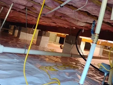 An installed crawlspace vapor barrier